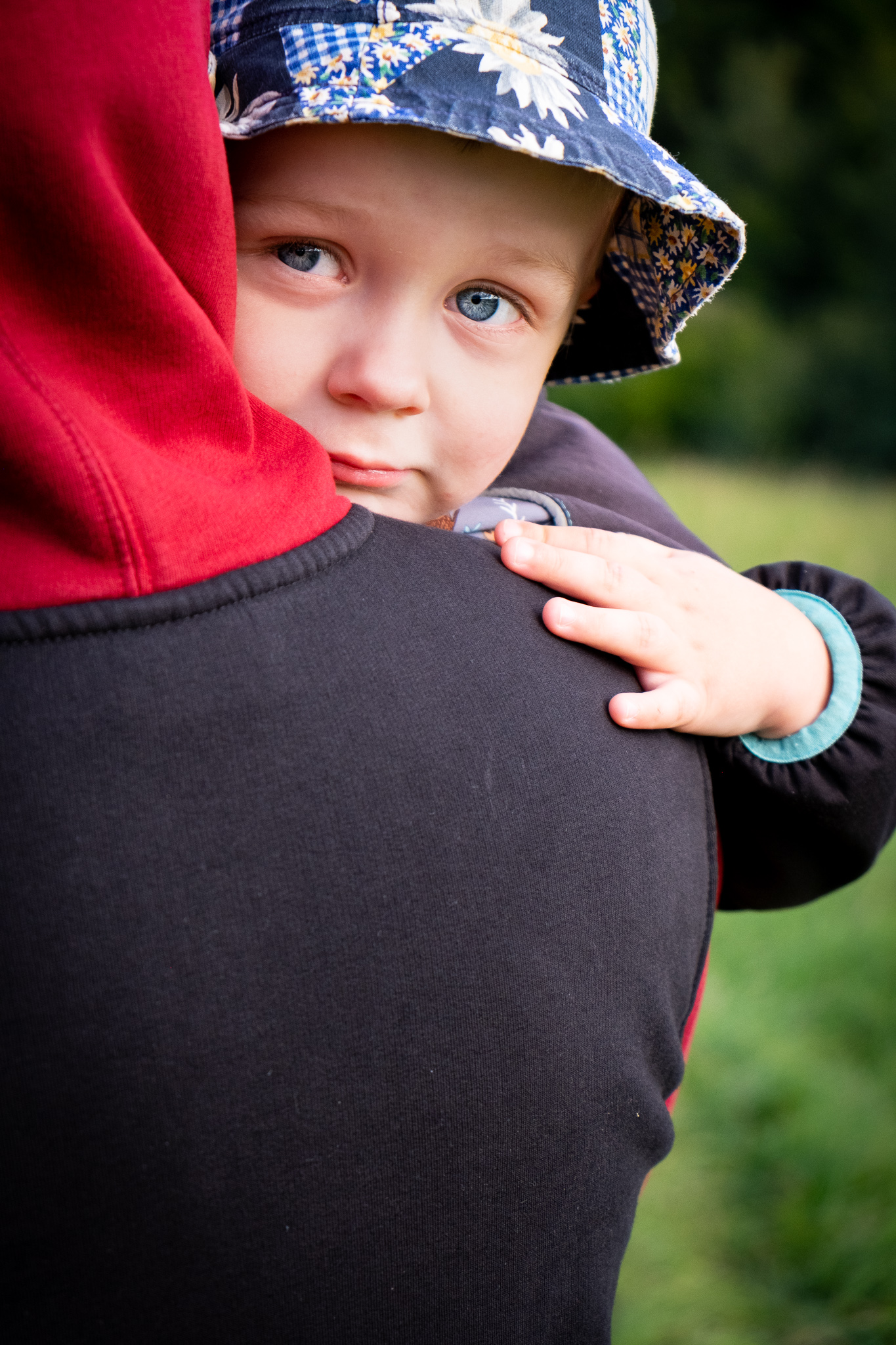 picture of a dad carrying his little son