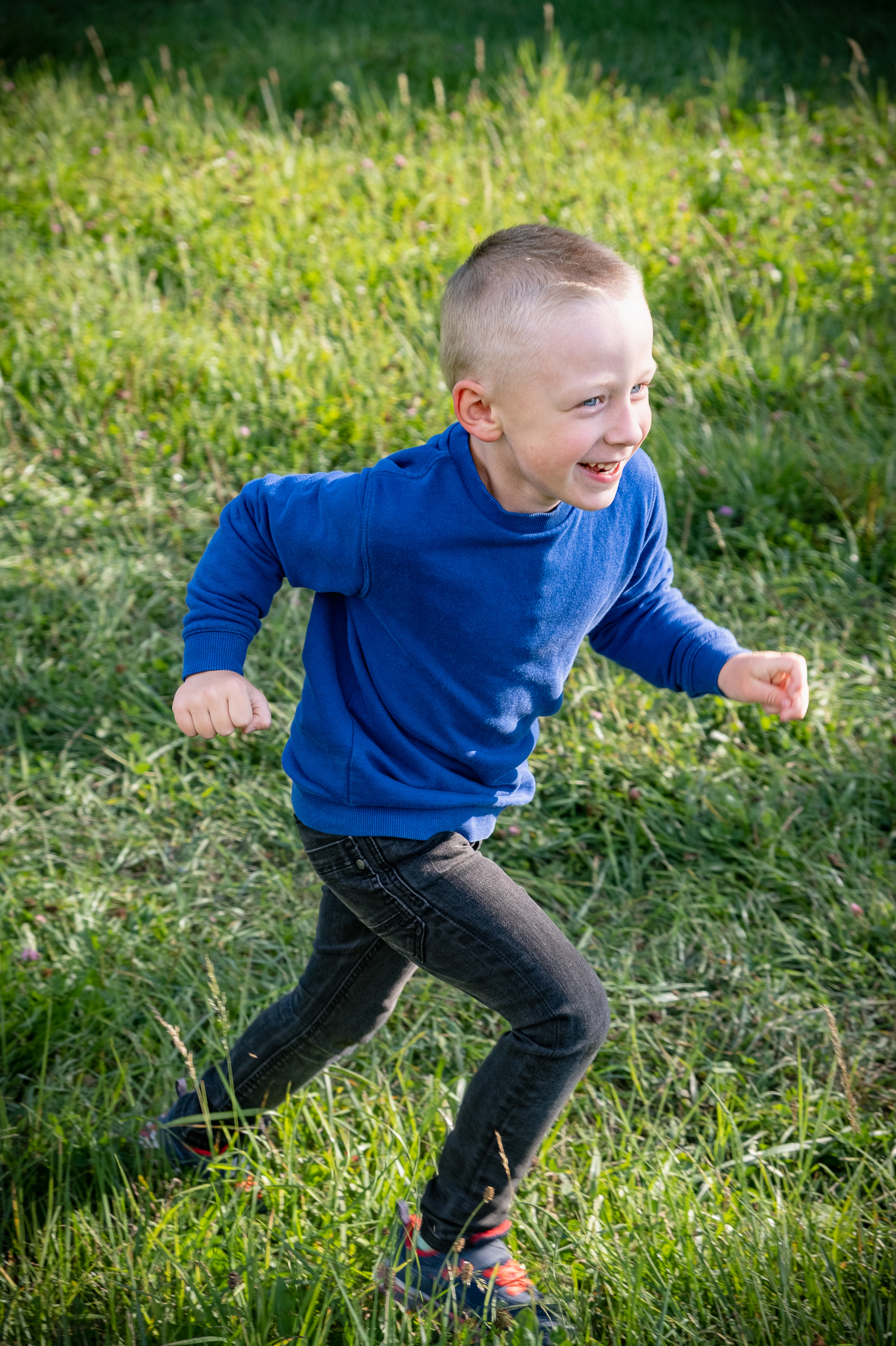 picture of boy in blue running