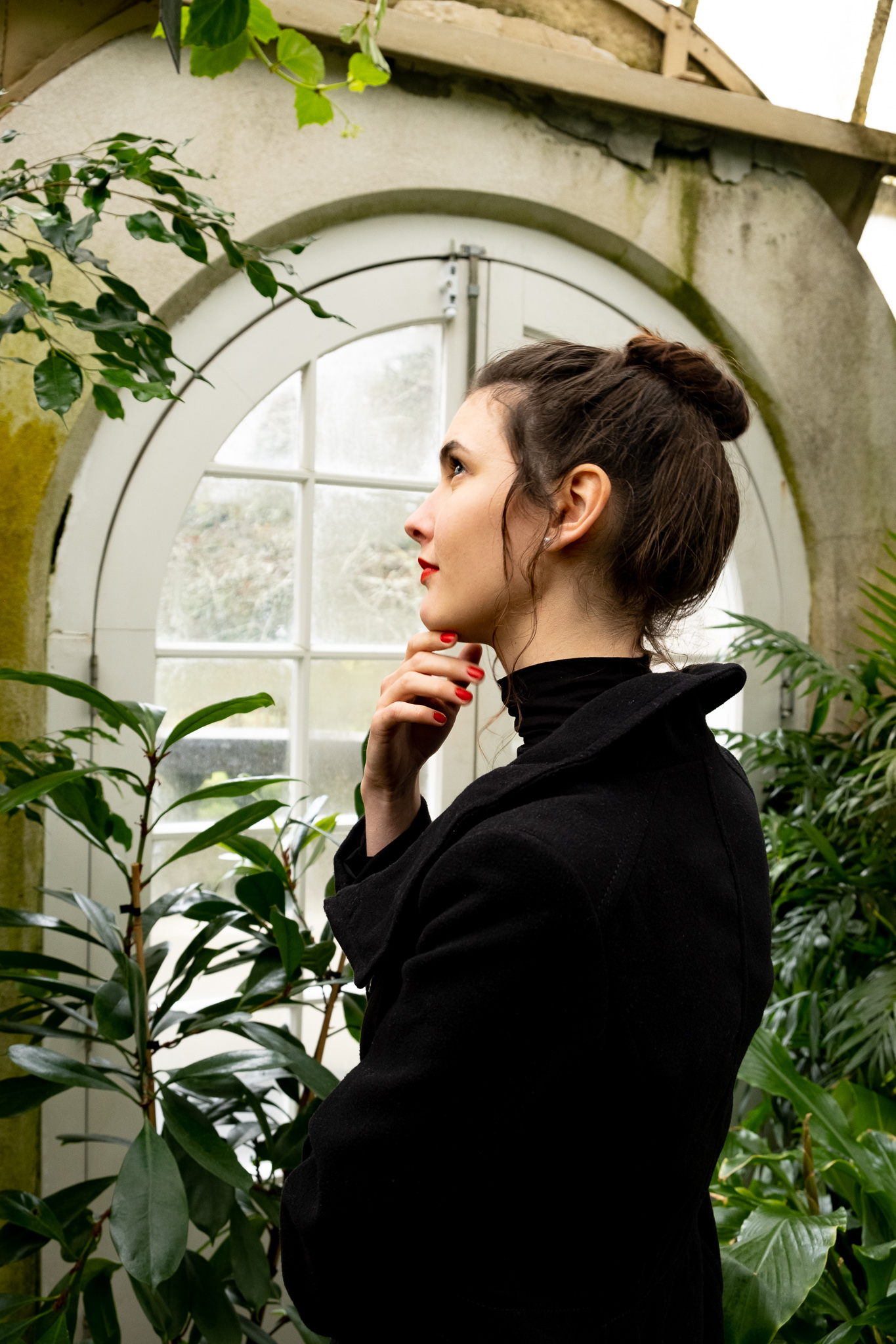women portrait in green house